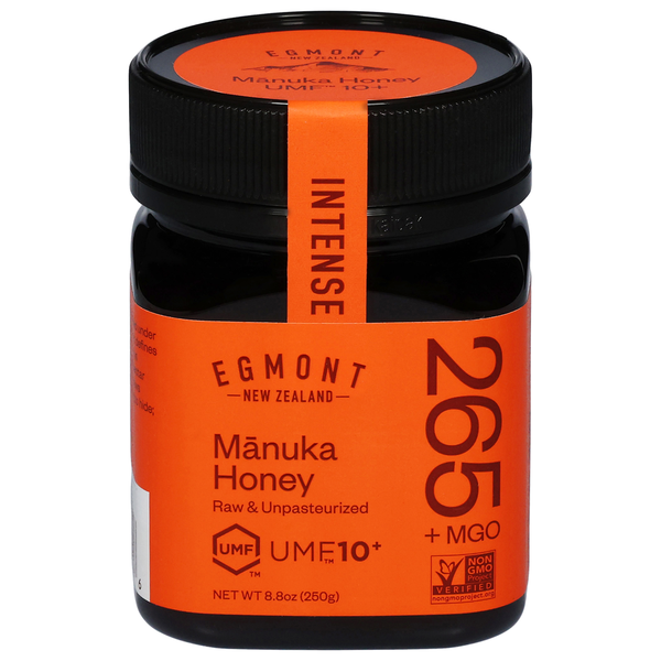 Jar of Egmont Manuka Honey with orange label and black lid on a white background