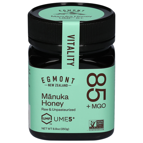 Egmont New Zealand Manuka Honey jar with green label and black lid on a white background