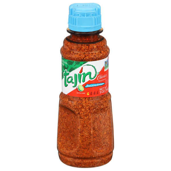 Bottle of Tajin Claro seasoning with a blue cap on a white background