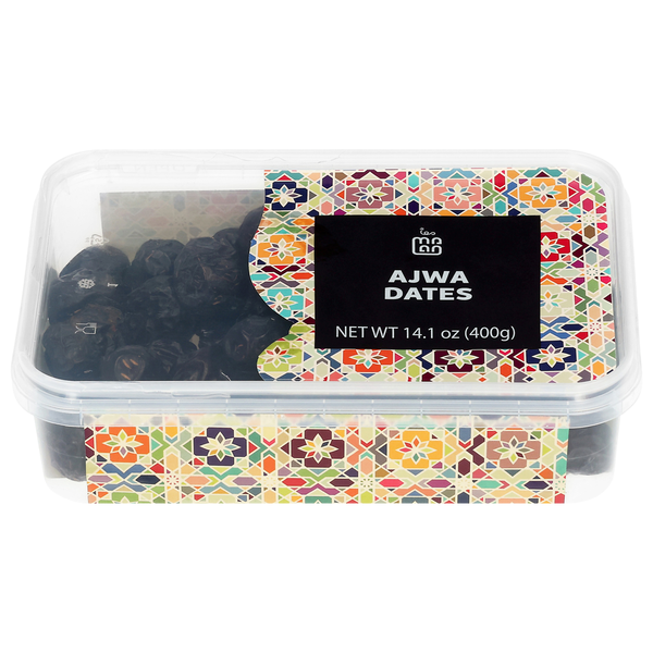 Container of Ajwa dates with decorative lid on a white background