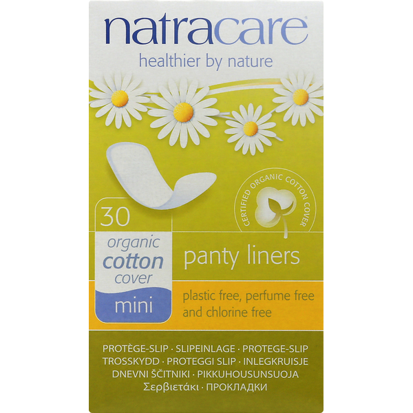 Box of Natracare organic cotton panty liners with daisy flowers on a green background