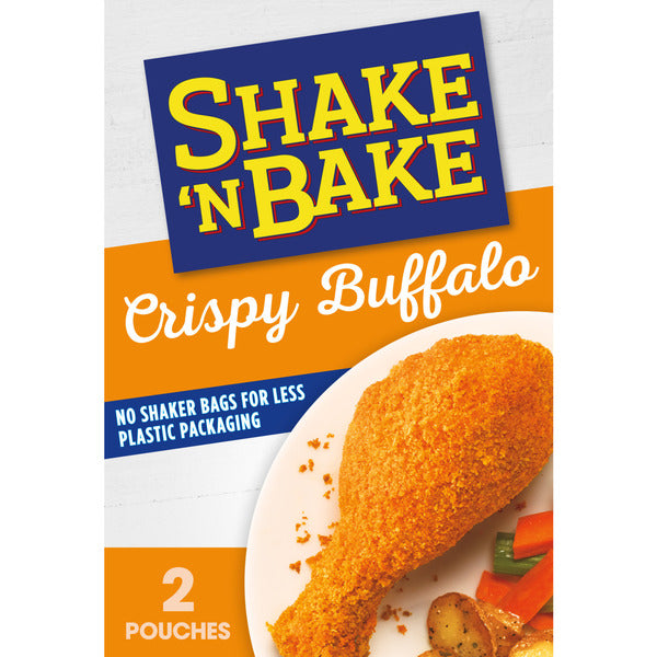 Shake 'N Bake Crispy Buffalo seasoning package with a chicken drumstick on a plate.
