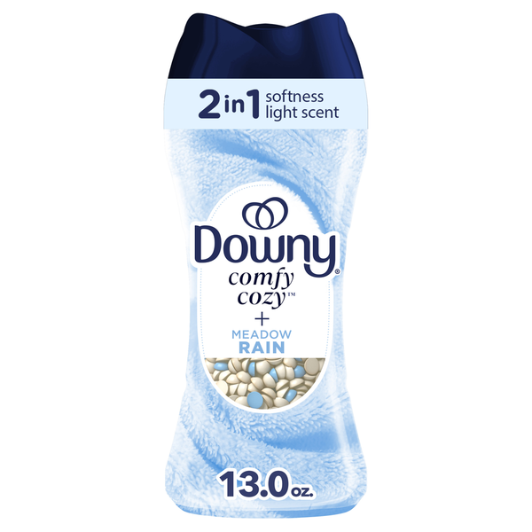 Downy fabric softener bottle with '2 in 1 softness light scent' and 'Comfy Cozy + Meadow Rain' on a white background.